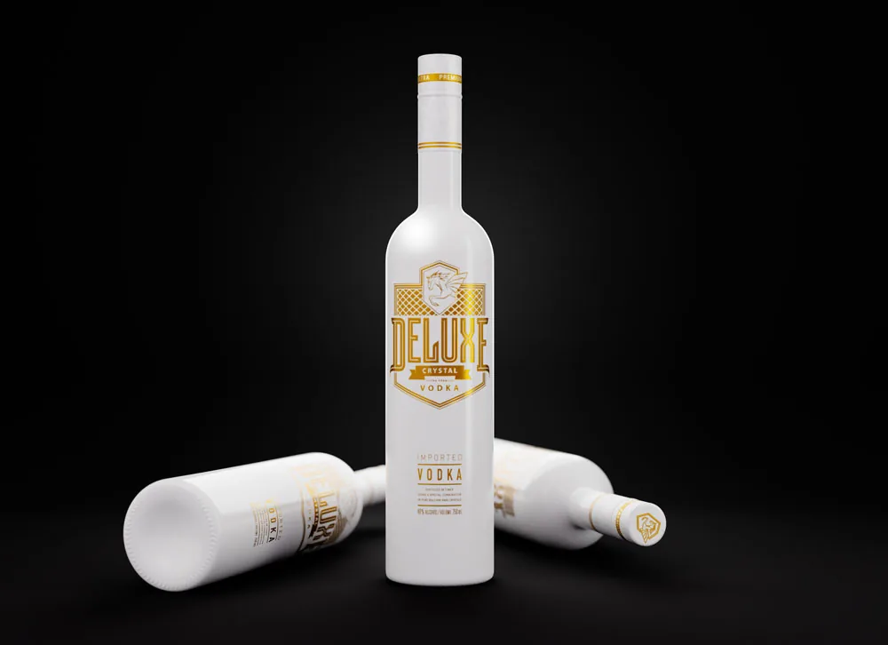 Deluxe Crystal Vodka standing beside two resting bottles on a dark surface